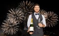 Man with bottle of champagne and glasses at party Royalty Free Stock Photo