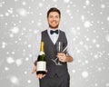 Man with bottle of champagne and glasses at party Royalty Free Stock Photo