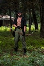Man With A Bow And Arrows In Woods Royalty Free Stock Photo