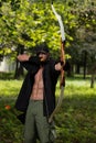 Man With A Bow And Arrows In Woods Royalty Free Stock Photo