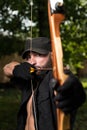 Man With A Bow And Arrows In Woods Royalty Free Stock Photo
