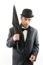 Man with bowler hat and an umbrella Royalty Free Stock Photo