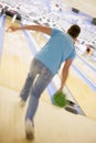 Man bowling, rear view (blurred motion) Royalty Free Stock Photo
