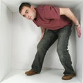 Man in a box Royalty Free Stock Photo