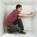 Man in a box Royalty Free Stock Photo