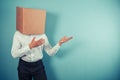 Man with box on head is pointing Royalty Free Stock Photo