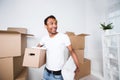 Man with a box in his hands is planning a new home interior Royalty Free Stock Photo