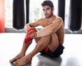 Man, boxer and workout in gym for fitness, training and determination with gloves for match. Male athlete, mma and Royalty Free Stock Photo