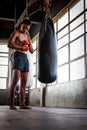 Man boxer wrapping his hand in boxing arena sport.