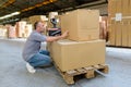 Man with boxes in warehouse