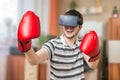 Man is boxing in 3D virtual reality video game with vr headset