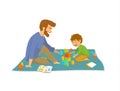 Man and boy, father and son palying on floor at home developing games