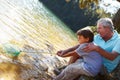 Man and boy fishing together