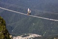 Man and boy in the mountains on an extreme walk