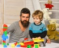 Man and boy play together. Dad and kid with toys Royalty Free Stock Photo