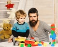 Man and boy play together. Dad and kid with toys Royalty Free Stock Photo