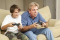 Man and Boy Play Video Games Royalty Free Stock Photo