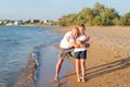 Man and a boy are standing on the beach Royalty Free Stock Photo