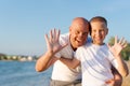 Man and a boy are standing on the beach Royalty Free Stock Photo