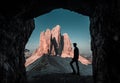 Man, boy is standing in the middle of Dolomites mountains