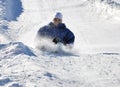 Man Braking While Sledding Down the Hill