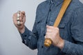 A man with brass knuckles and a bat in his hands, street gangs of robbers Royalty Free Stock Photo