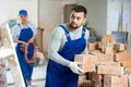 Man bricklayer carrying bricks during repair works in apartment