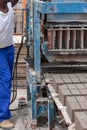 Man and bricks machine Royalty Free Stock Photo