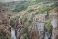 Man on bridge over river gorge Royalty Free Stock Photo