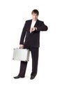 A man with a briefcase looking at his watch Royalty Free Stock Photo