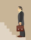 Man with briefcase walking upstairs Royalty Free Stock Photo