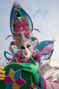 Man in brightly colored jester`s costume and mask at Venice Carnival Royalty Free Stock Photo