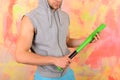 Man with bristle on colorful background. Guy in sleeveless hoodie