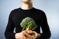 Man with broccoli Royalty Free Stock Photo