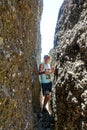 A man in a Broken heart stone, at the Demerdzhi tract. Crimea 2021 Royalty Free Stock Photo