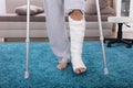 Man With Broken Leg Walking On Carpet Royalty Free Stock Photo