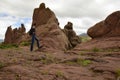 The man on the brown rocks near the Gate of Hayu Mark (The Gate of the Gods), Peru WILLKA UTA, HAYUMARKA GATE. Puno Peru Royalty Free Stock Photo