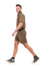 Man in brown uniform walking Royalty Free Stock Photo