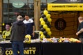 A Man Browsing at a Harrogate AFC Football Club Memorabilia Stand in the Town Centre.