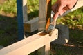 A man with a brush in his hand Painting a protective coating to a wood Royalty Free Stock Photo