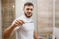 Man brushes his teeth in bathroom, morning hygiene Royalty Free Stock Photo