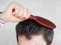Man brushing hair Royalty Free Stock Photo