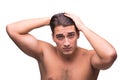 The man brushing his hair isolated on white Royalty Free Stock Photo