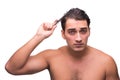 The man brushing his hair isolated on white Royalty Free Stock Photo