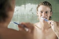 Man Brushing Teeth In Front Of Mirror Royalty Free Stock Photo