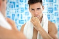 Man brushing teeth in front of mirror Royalty Free Stock Photo