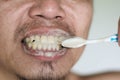 Man brushing teeth with herb toothpaste Royalty Free Stock Photo