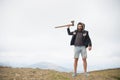 Man brutal bearded hipster with axe stand on mountain top Royalty Free Stock Photo