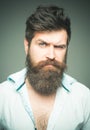 Man brutal bearded hipster strict face close up. Growing epic beard also means growing mustache. Trim and keep naturally