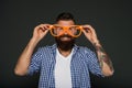Man brutal bearded hipster wear funny eyeglasses accessory. Human strengths and virtues. Positive mood. Positive